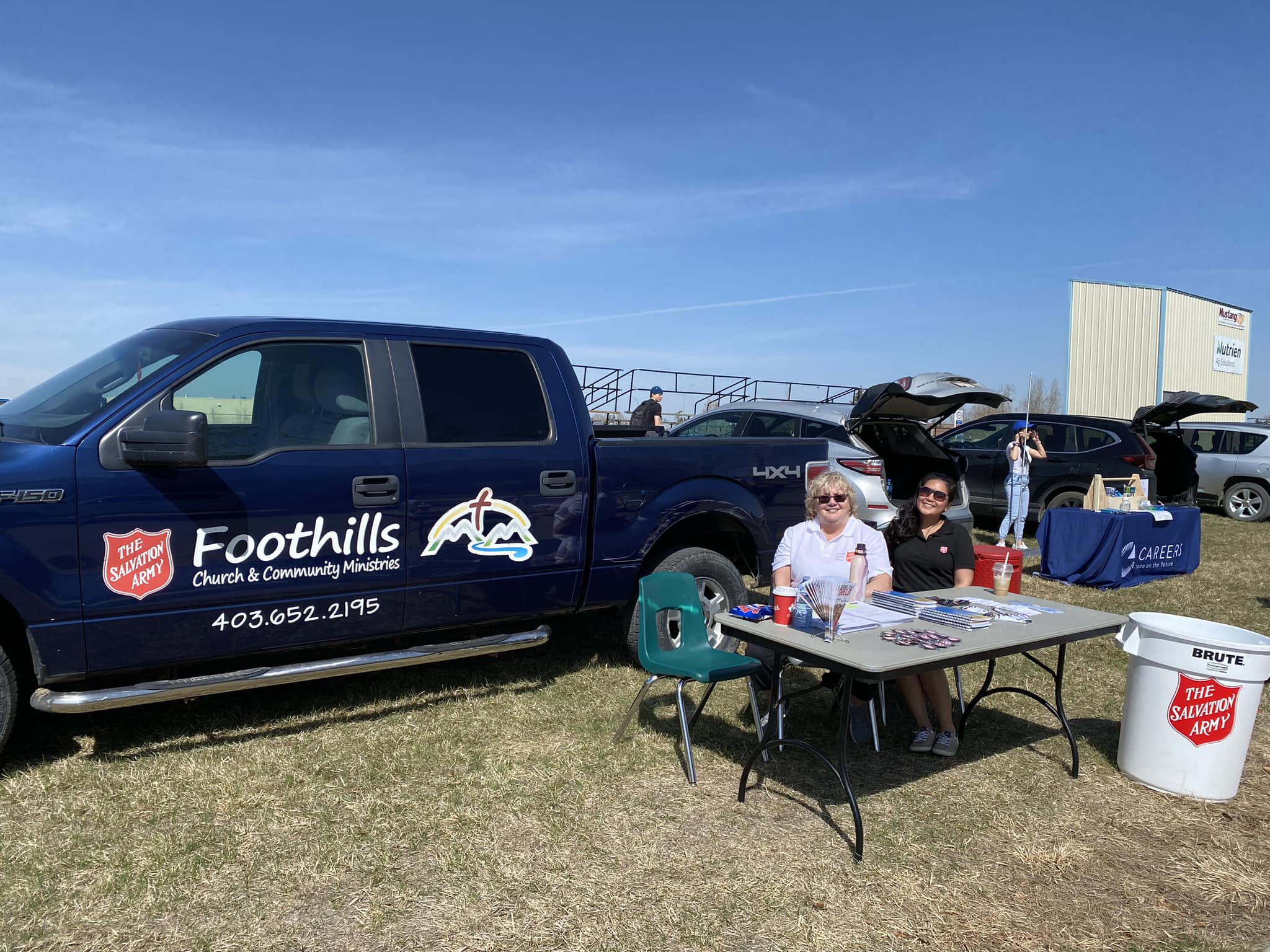 Foothills Church employees seated outside smiling at the camera