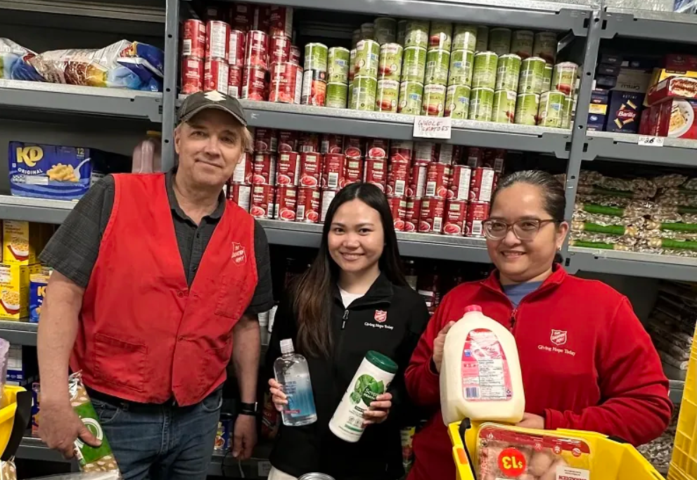Three Foothills TSA staff holding food